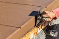 Construction Worker Using Stainless Steel Edger On Wet Cement Forming Coping Around New Pool Royalty Free Stock Photo