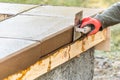 Construction Worker Using Stainless Steel Edger On Wet Cement Forming Coping Around New Pool Royalty Free Stock Photo