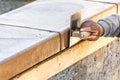 Construction Worker Using Stainless Steel Edger On Wet Cement Forming Coping Around New Pool