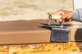 Construction Worker Using Stainless Steel Edger On Wet Cement Forming Coping Around New Pool