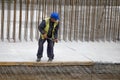 Construction worker using tape measure