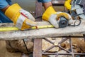 Construction worker are using tape measurements to measure planks and pencil are used to write, Close up of male hands measuring Royalty Free Stock Photo