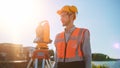 Construction Worker Using Theodolite Surveying Optical Instrument for Measuring Angles in Horizont Royalty Free Stock Photo