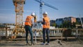 Construction Worker Using Theodolite Surveying Optical Instrument for Measuring Angles in Horizont Royalty Free Stock Photo