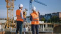 Construction Worker Using Theodolite Surveying Optical Instrument for Measuring Angles in Horizont Royalty Free Stock Photo