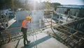 Construction Worker Using Theodolite Surveying Optical Instrument for Measuring Angles in Horizont Royalty Free Stock Photo