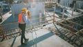 Construction Worker Using Theodolite Surveying Optical Instrument for Measuring Angles in Horizont Royalty Free Stock Photo