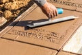 Worker Using Trowel On Wet Cement Forming Coping Around New Pool Royalty Free Stock Photo