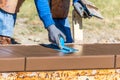 Construction Worker Using Trowel On Wet Cement Forming Coping Around New Pool Royalty Free Stock Photo