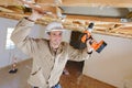 construction worker wear safety uniform installation ceiling work Royalty Free Stock Photo