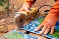 Construction worker wearing orange rubber gloves