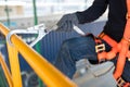 Construction worker wearing safety harness and safety line Royalty Free Stock Photo