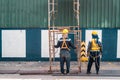 Construction worker wearing safety harnesses with Scaffolding at construction site. working at heights above ground ,Safe working