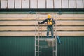 Construction worker wearing safety harnesses on Scaffolding at construction site. working at heights above ground ,Safe working