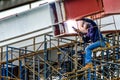 A Construction Worker welding steel bars. Royalty Free Stock Photo