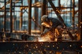 Construction Worker Welding With Torch Creating Sparks at Partially Completed Structure Royalty Free Stock Photo