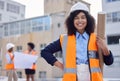 Construction worker, woman with blueprint and floor plan, engineering and architect at work site. Project management Royalty Free Stock Photo