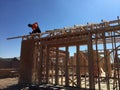 Construction worker working on the framing process for a new a house Royalty Free Stock Photo