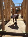 Construction worker working on the framing process for a new a house Royalty Free Stock Photo