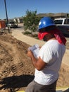 Construction worker working on the framing process for a new a house.