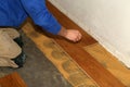 Construction worker working on installing the parquets on the floor