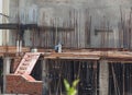 A construction worker working on the roof supported by bars Royalty Free Stock Photo