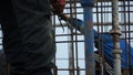 Construction worker working on a construction site. Clip. Employee works at the construction site Royalty Free Stock Photo
