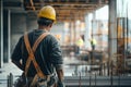 Construction Worker Overseeing Project Progress in Urban Building Site Royalty Free Stock Photo