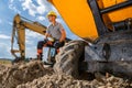 Construction Worker Resting Near Heavy Machinery During Sunny Day at Construction Site Royalty Free Stock Photo