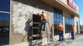 Construction Workers Applying Stucco to a Commercial Building Royalty Free Stock Photo