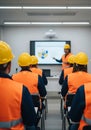 Construction Workers Attending Training in Yellow Hard Hats and Orange Vests Royalty Free Stock Photo