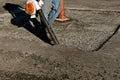 Cleaning debris from an asphalt paving project Royalty Free Stock Photo