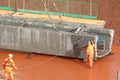Construction workers with a bridge beam Royalty Free Stock Photo