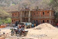 Construction workers build an apartment block on bamboo scaffold