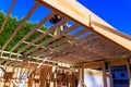 Construction workers build wooden roof frame at residential site Royalty Free Stock Photo