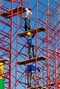 Construction workers building a new structure in city