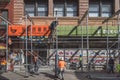 Construction workers building scaffolding