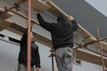Construction workers building scaffolding 2