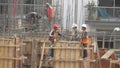 Construction Workers on Building Site