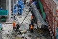 Construction workers at building site with scaffolding Bangkok Thailand Royalty Free Stock Photo