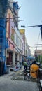 Construction workers carrying out renovations for a 3-story multi-story building with a concrete machine and scaffolding. Royalty Free Stock Photo