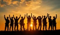 Construction workers celebrating teamwork, silhouettes against sunset, fists raised, unity, determination, industrial Royalty Free Stock Photo
