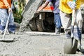 Construction Workers Cementing Road