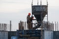Construction workers at a construction site pouring concrete Royalty Free Stock Photo