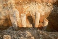 Construction workers cutting concrete bore pile up to the determined level at the construction site.