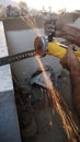 Construction workers cutting steel for fabrication work at a under construction building