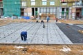 Construction workers doind on a iron reinforcement and concrete