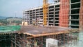 Construction workers fabricated timber formwork and reinforcement bar.