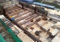 Construction workers fabricated timber formwork and reinforcement bar.