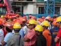 Construction workers gathered in the open space at the construction site to hear morning talks.